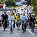 The Crown Prince and Crown Princess cycling "the Eco road" together with young and old in Grimstad (Photo: Gorm Kallestad / Scanpix)
